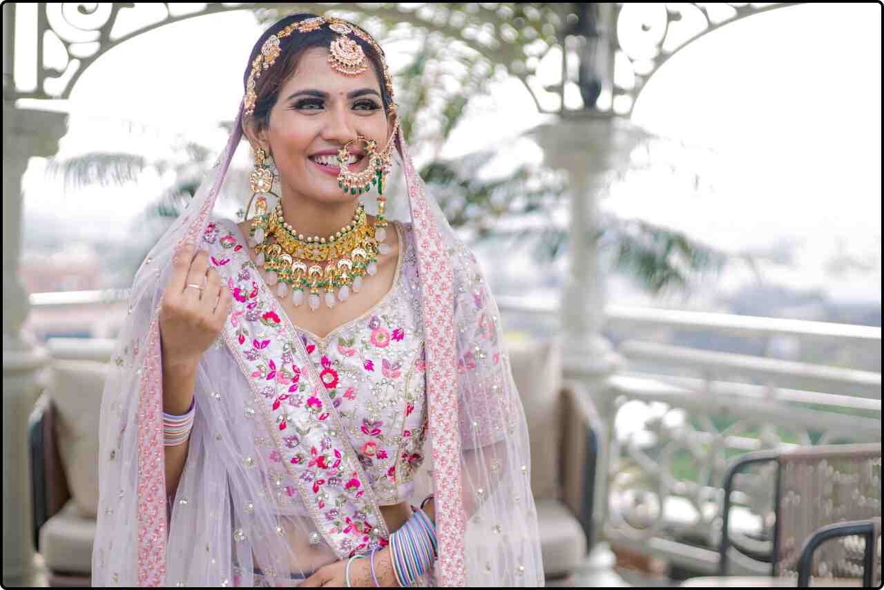 Bride in an elegant Indian sari with a modern twist, smiling brightly.